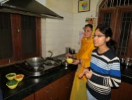 Learning how to cook lentils at a home-hosted dinner in Jaipur