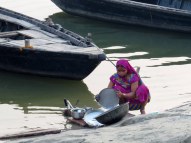 Cleaning dishes in the Ganges River, Varanasi.