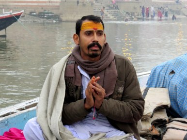 A Hindu priest joined us on the river at dawn and gave us a New Year blessing. He also tied some yellow and red string around our wrists for good luck.